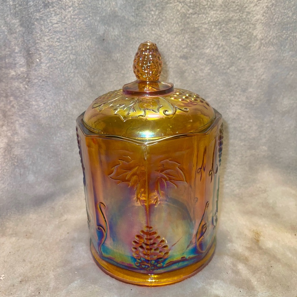Vintage Indiana grape panel carnival iridescent marigold glass container.